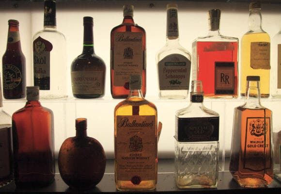 old liquor bottles displaying in a former distillery in the Distillery Historic District.